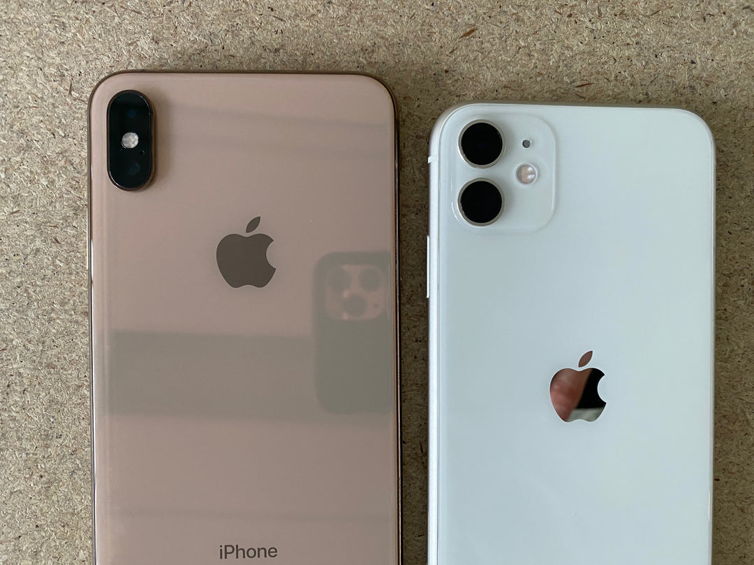 Gold Apple iPhone XS Max beside white Apple iPhone 11 