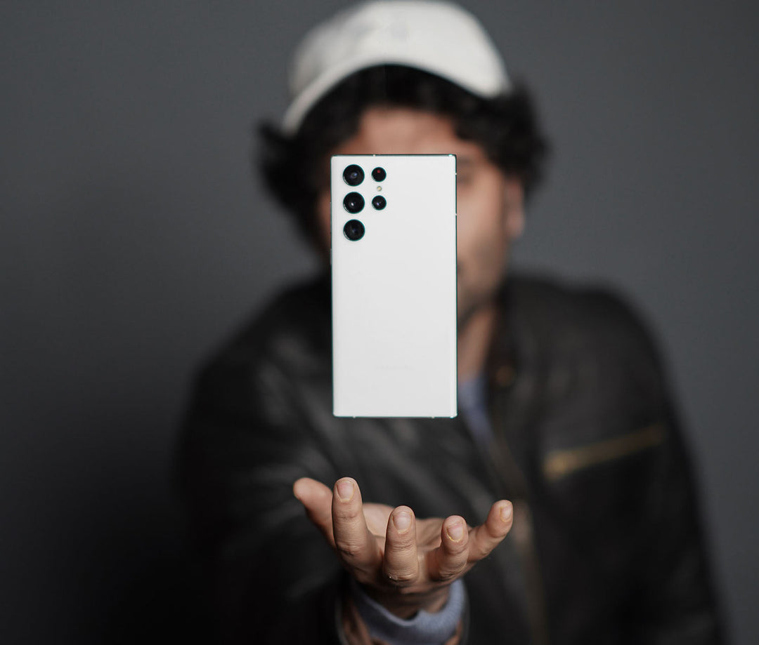 Youthful guy with Samsung Galaxy S23 Ultra